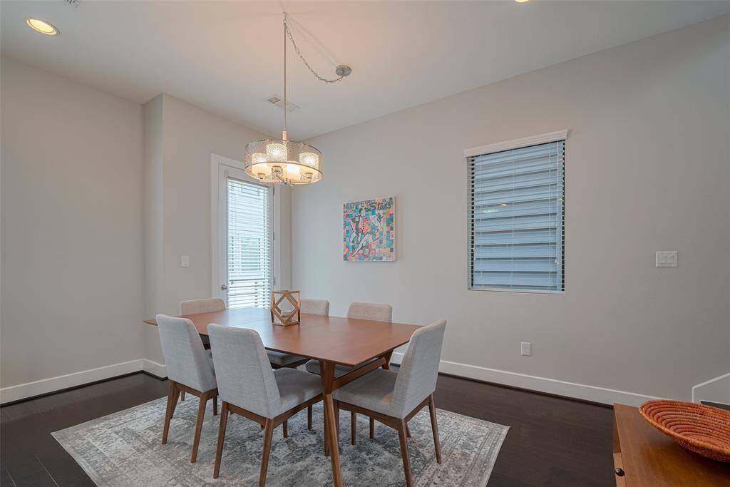 Currently set for 6, but a table for 8 would work too! Notice there is a patio door adjacent.