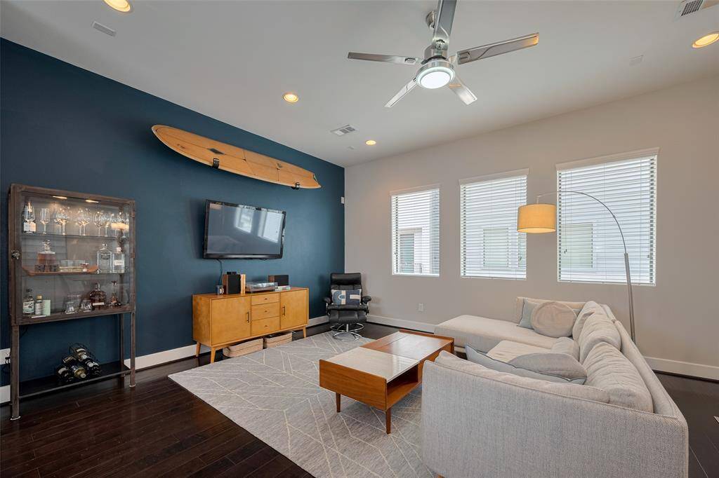 That accent wall and windows draw you in!