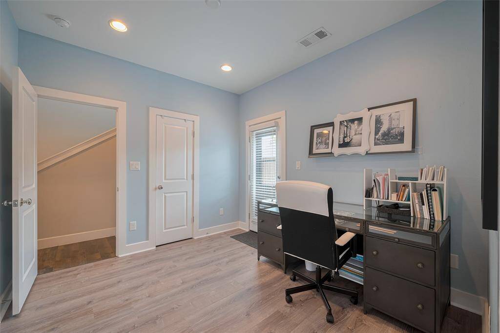 This angle shows the entrance to room, walk in closet door, and patio door.