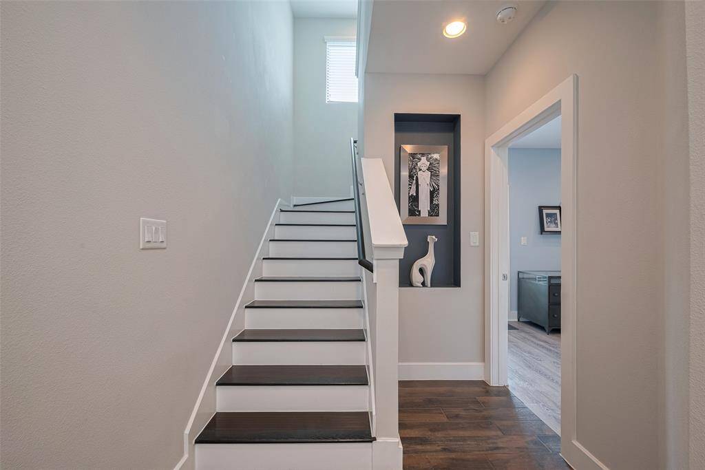 As you enter the home you have a great foyer space and are greeted by an art niche and the stairs to second floor! To the right is first floor bedroom, but we will come back to that!