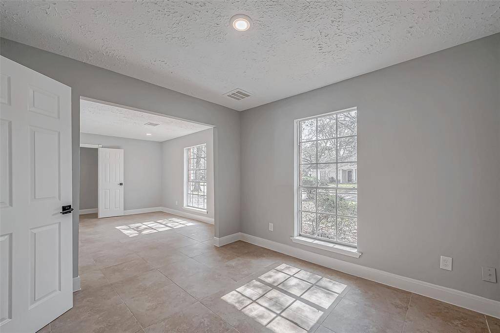 View from the formal dining room looking back to the front entry. So much light.
