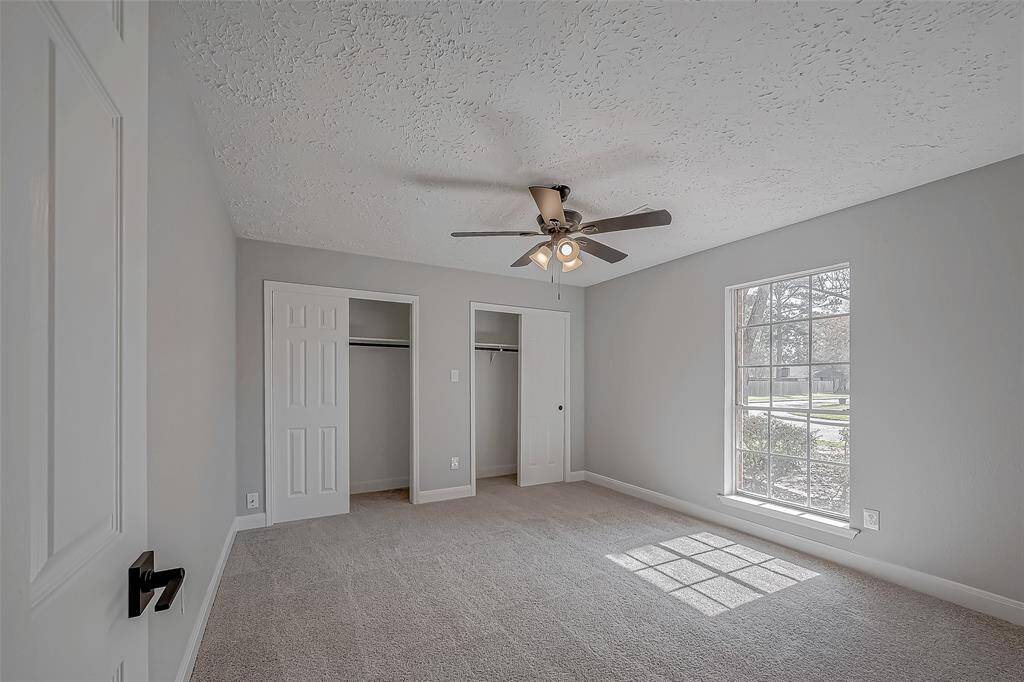 This first floor bedroom could be an office, primary bedroom, guest suite, flex room.