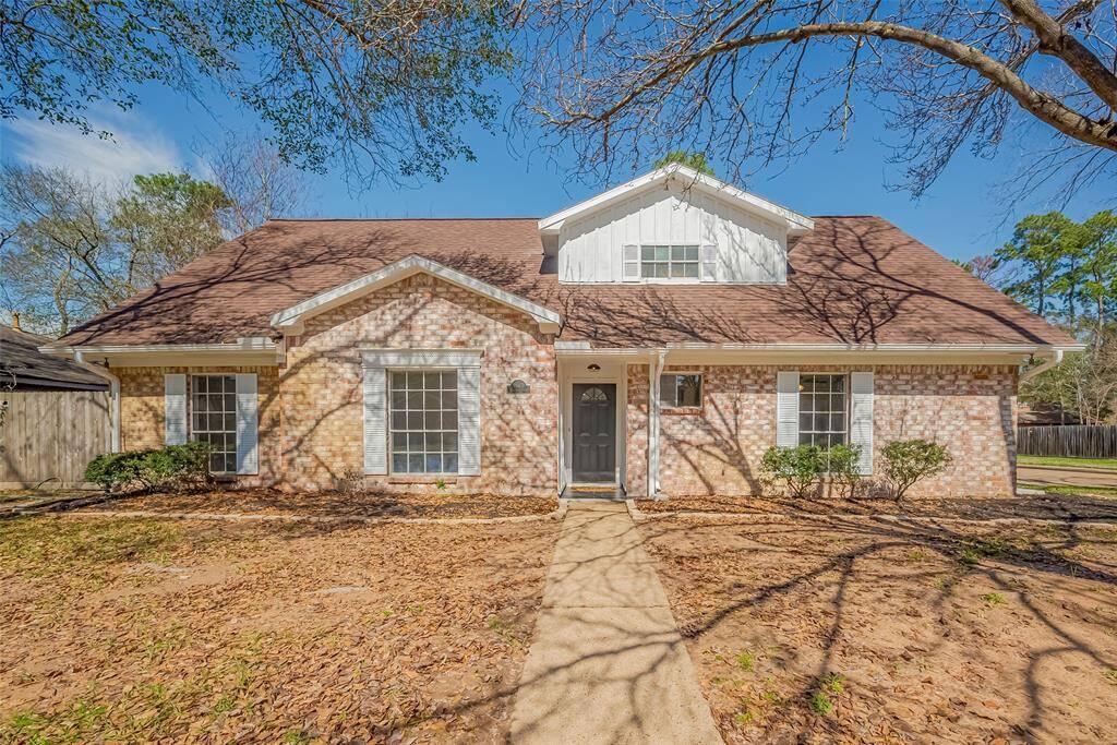Low-maintenance, mostly brick home with a quaint front porch.