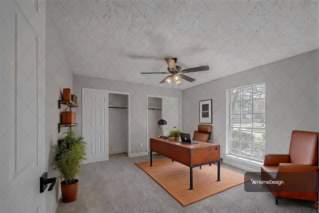 Virtually staged as a home office. Two closets flank the back wall.