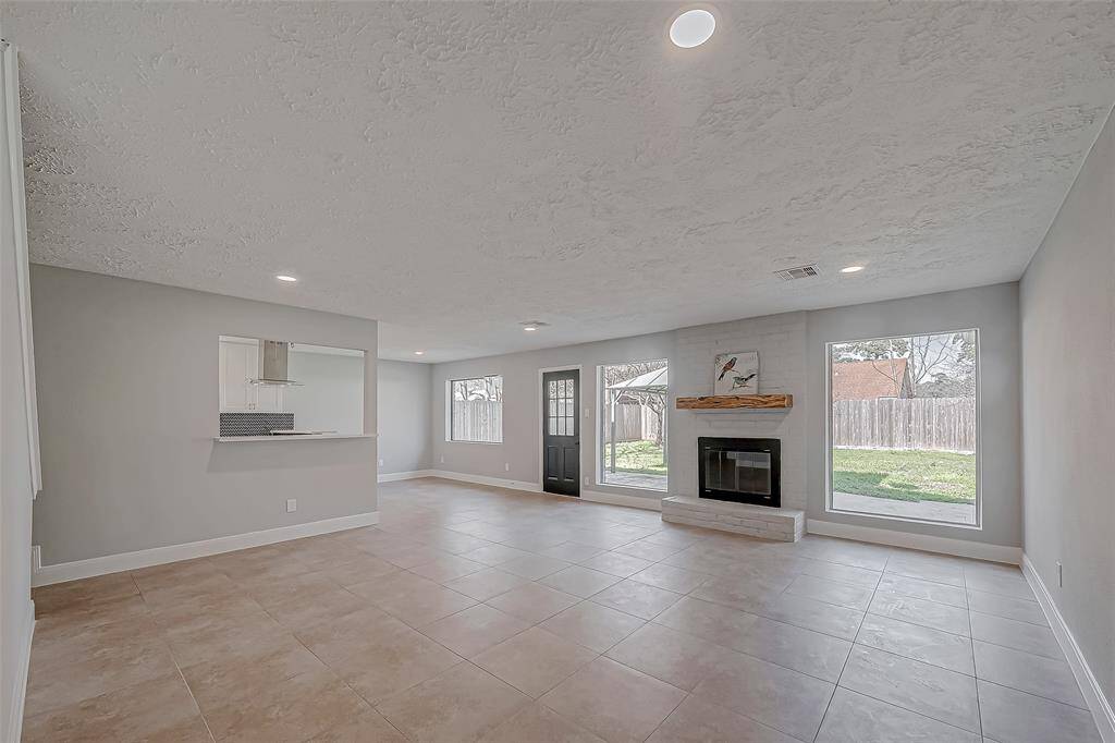 Large windows in the main living space let in lots of natural light. Curl up by your gas log fireplace on cold winter days.