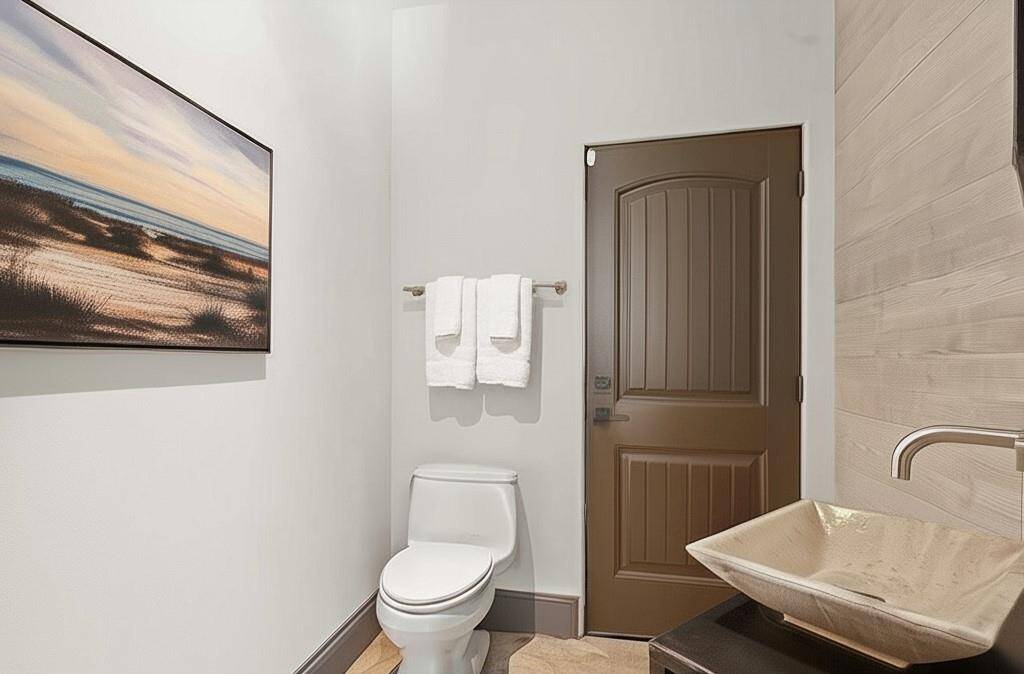 1/2 Bath located on the first floor with entry to the pool