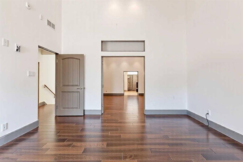 Sliding doors opening to Primary Bedroom