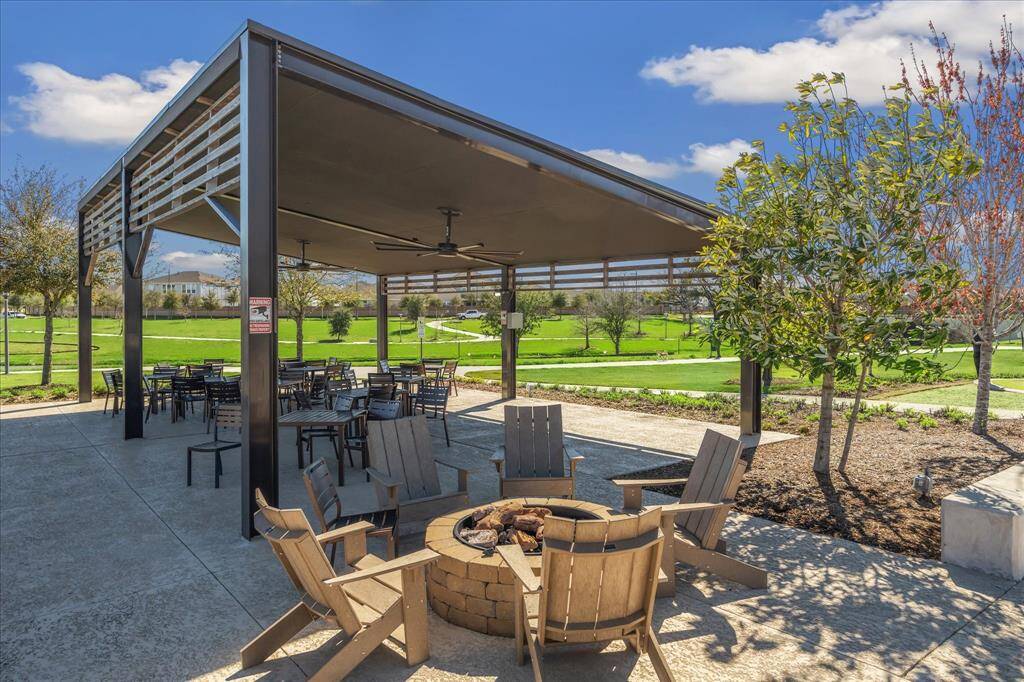 Community fire pit and covered seating area.