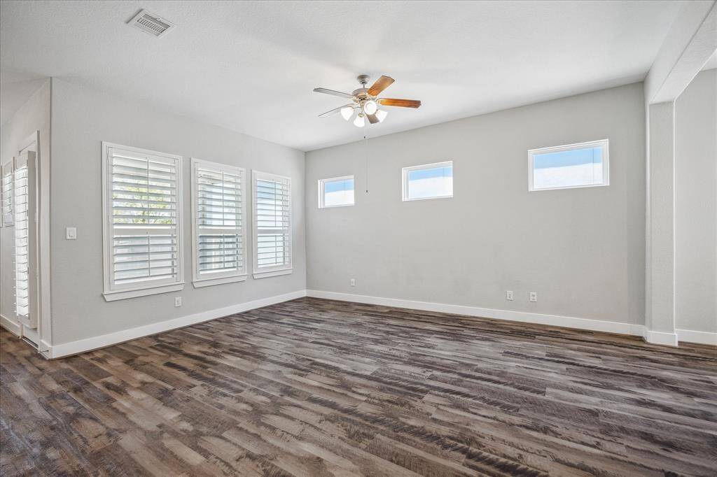 Another view of large open Living Room with luxury vinyl plank floors.