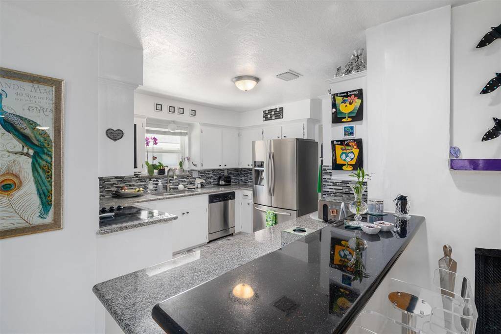 Breakfast bar opens to living area