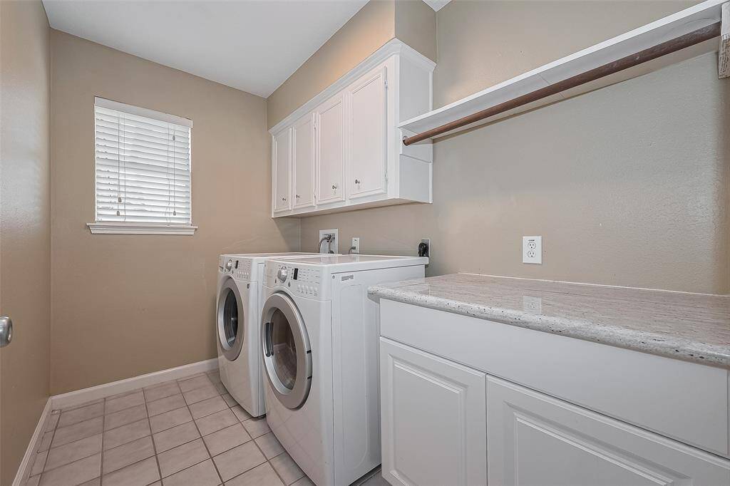 Landry room with washer and dryer.