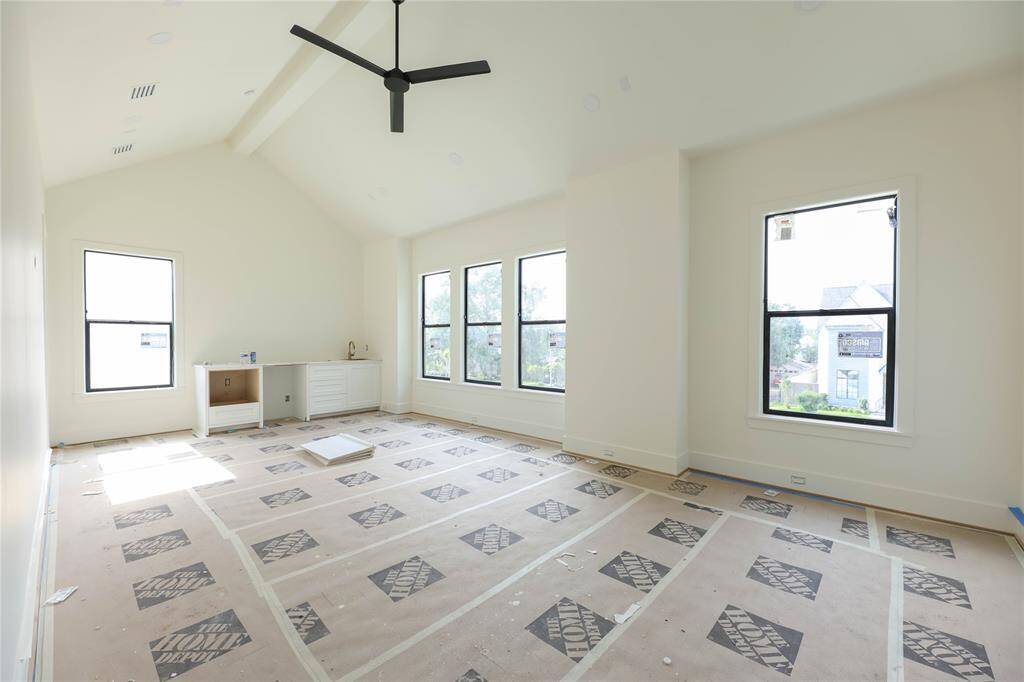 Entertain guests & family w/ this spacious 2nd floor Game Room, offering a built-in wet-bar with beverage fridge, microwave & additional drawers. Another secondary bedroom off to the left corner.