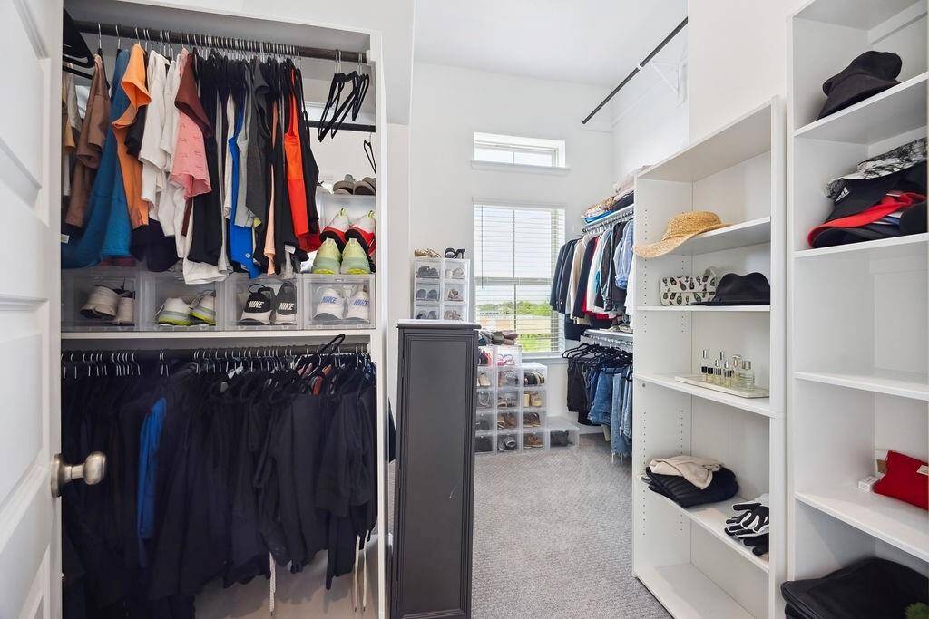 Spacious primary closet with built-ins