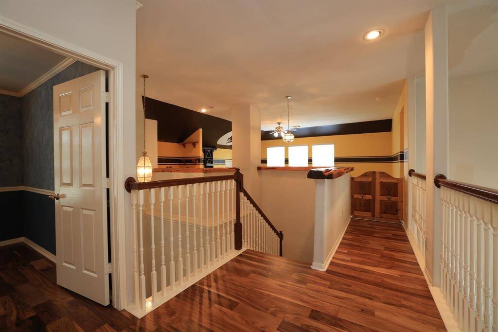 Primary bedroom with custom oak crown molding. Bamboo laminate flooring.