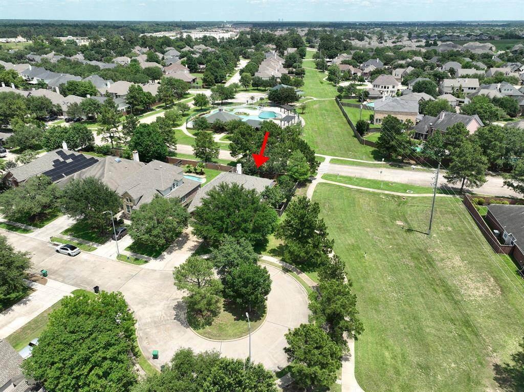 Fenced off side yard. Exterior deck with composite decking and pergola, pergola is wired for a light fixture or fan.