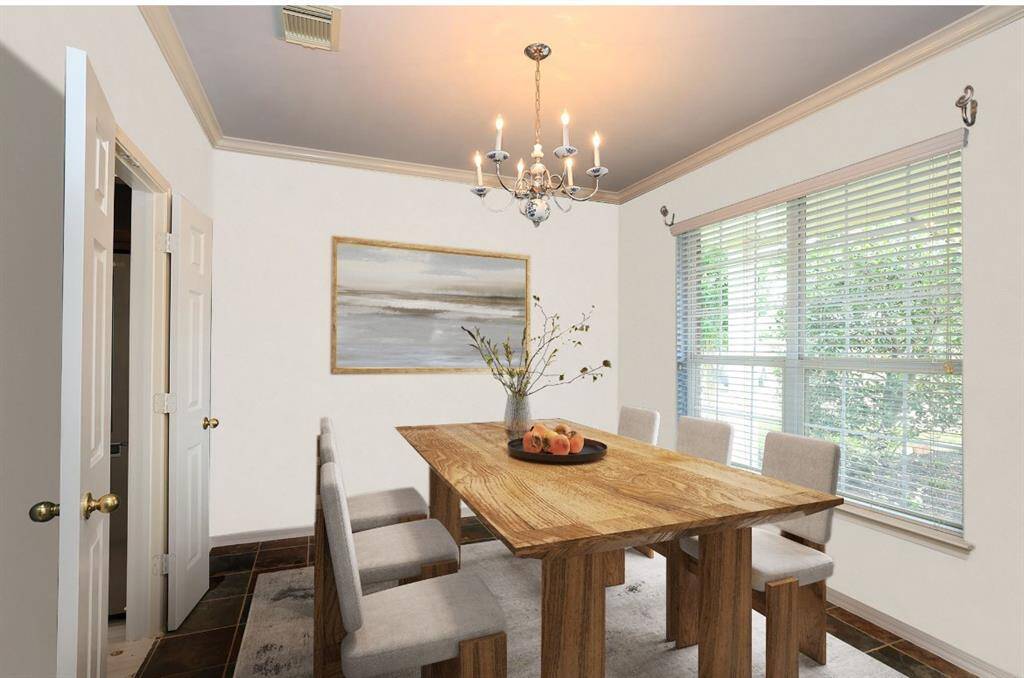 Slate floors with large overhead fan with light kit. Windows have UV radiant film.