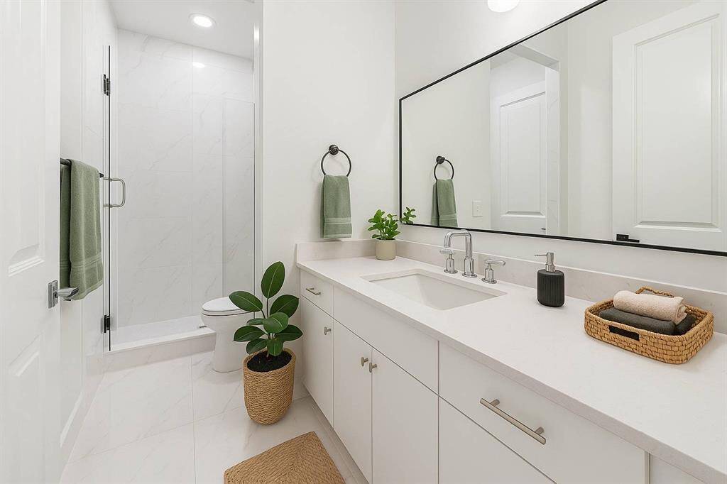 first floor secondary bathrooms with sweeping floor to ceiling tile