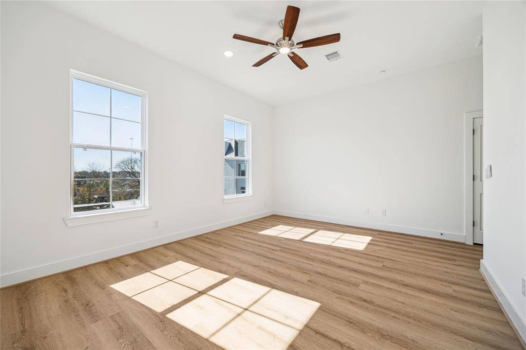 A view of the spacious primary bedroom. Plenty of room for an added sitting area..