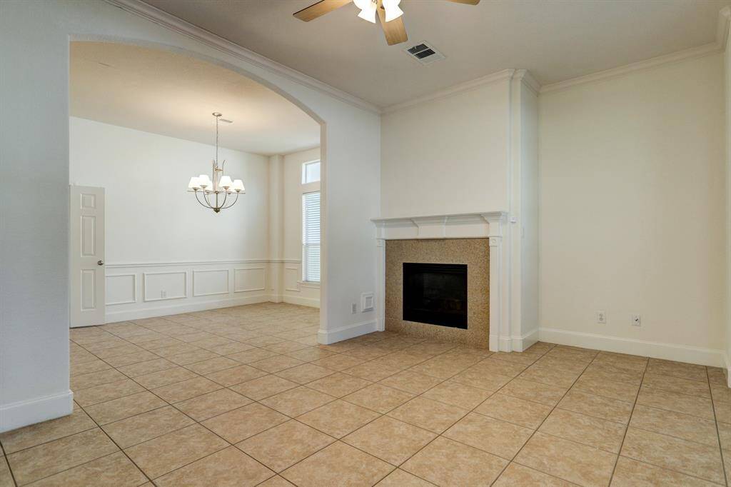 Gas fireplace in formal sitting connected to formal dining room