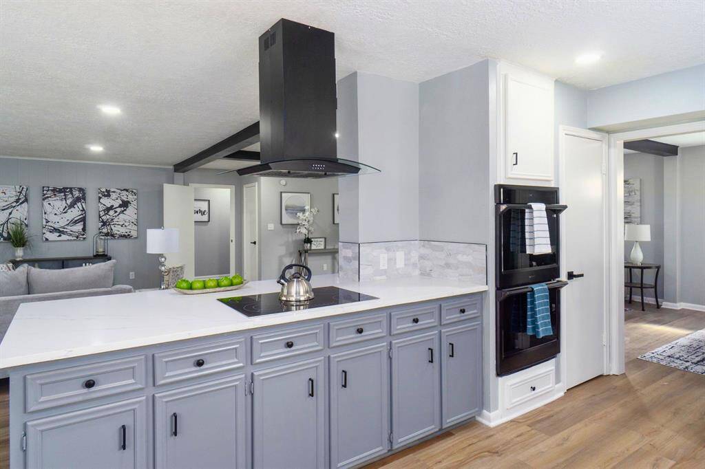 A chef's dream with beautiful quartz counters and ample storage