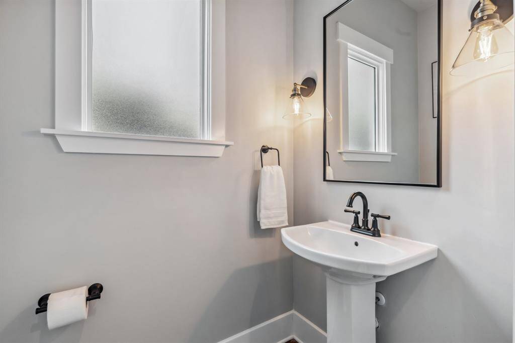 A windowed powder room adds convenience on the main level.