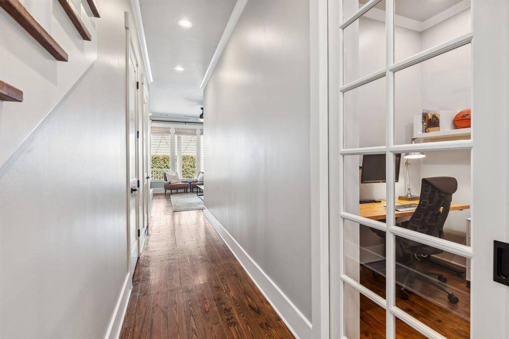 On the main level, the center hall is lined by a study, expansive under stair storage closet, and powder room.