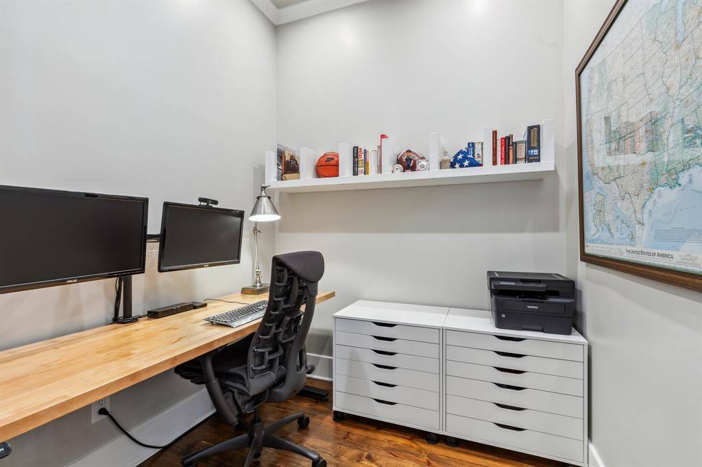 A glass door opens to the added study/home office, an excellent work-from-home destination.