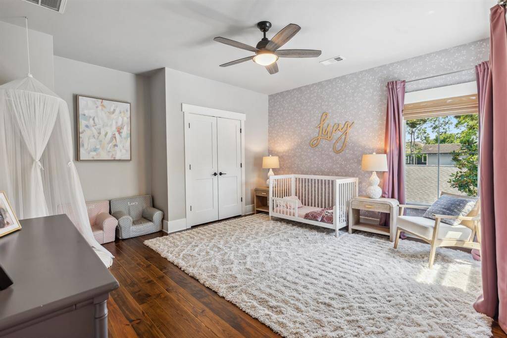This huge secondary bedroom could easily accommodate two or more beds alongside oversized windows, a ceiling fan and a large reach-in closet.