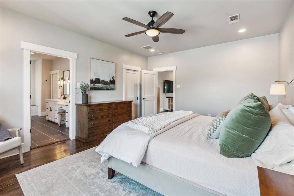 The primary bedroom provides plenty of space for a king-size bed, plus additional furniture and a sitting area.