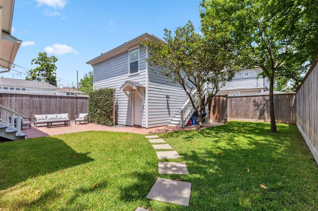 The paver walkway ushers tenants and guests directly from the front yard entrance to the garage apartment.