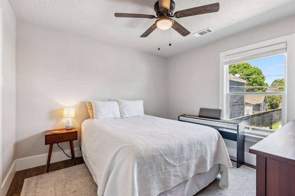 The garage apartment’s bedroom can easily accommodate a queen-size bed.