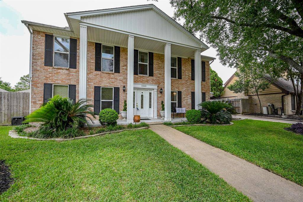 Colonial home with columns and beautiful curb appeal