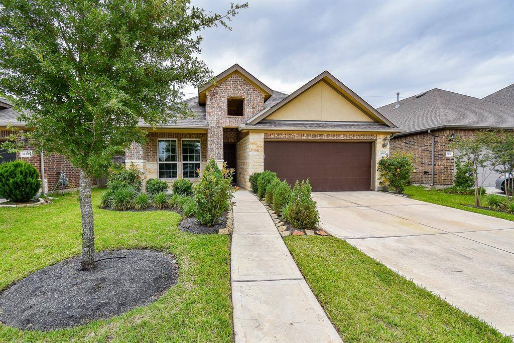 Yes! You can absolutely fall in love with a home at first sight! How inviting is this brick beauty?