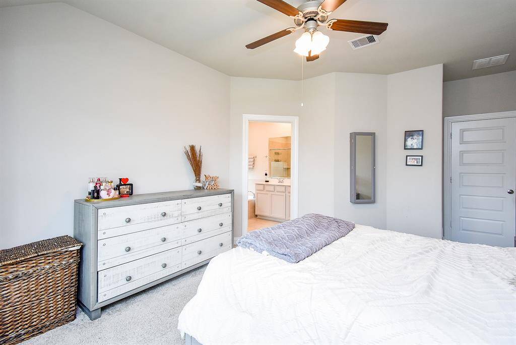 Your primary ensuite bath is just beyond the open door, up center.