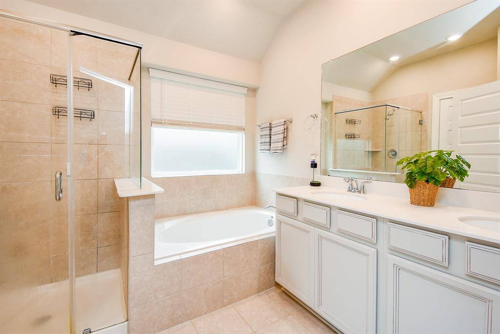 Simply sublime, your primary ensuite bath is compactly structured for easy access to creature comforts; with step-in shower and garden tub, side-by-side; with dual sinks and counter space stretching outward.