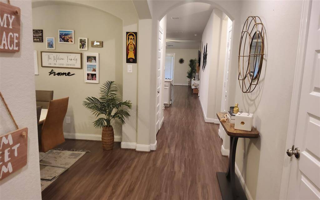 This is the long, lush view from entry all the way back to the living space.