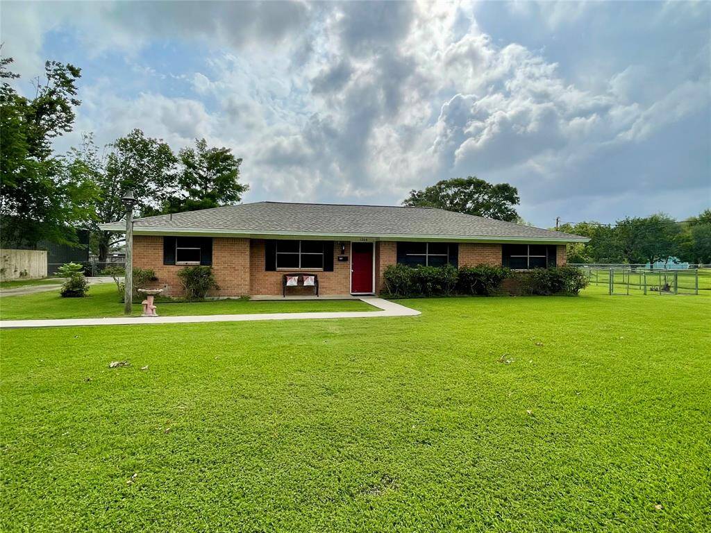 Lovely traditional home in Hillcrest Village on large +- 1/2 acre lot.