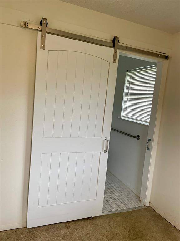 Updated sliding farm door to primary suite bathroom.