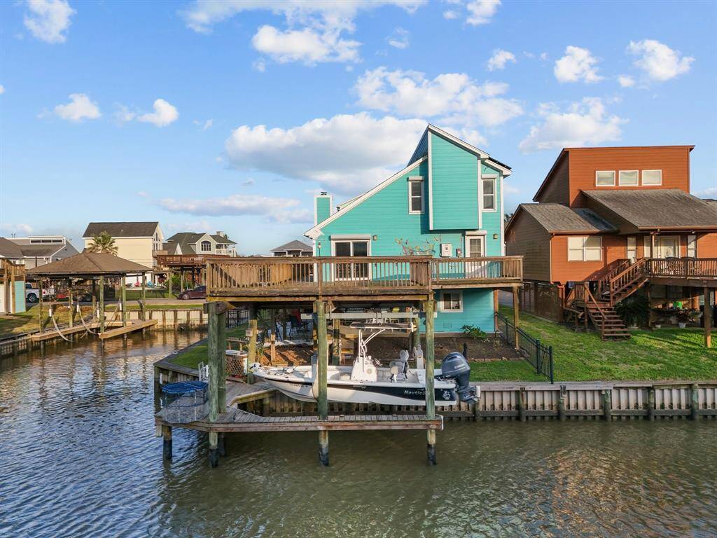 Boat house with boat lift is added bonus to your new home. Crab or fish right here off your dock, off your deck, off your boat, or off your bulkhead!