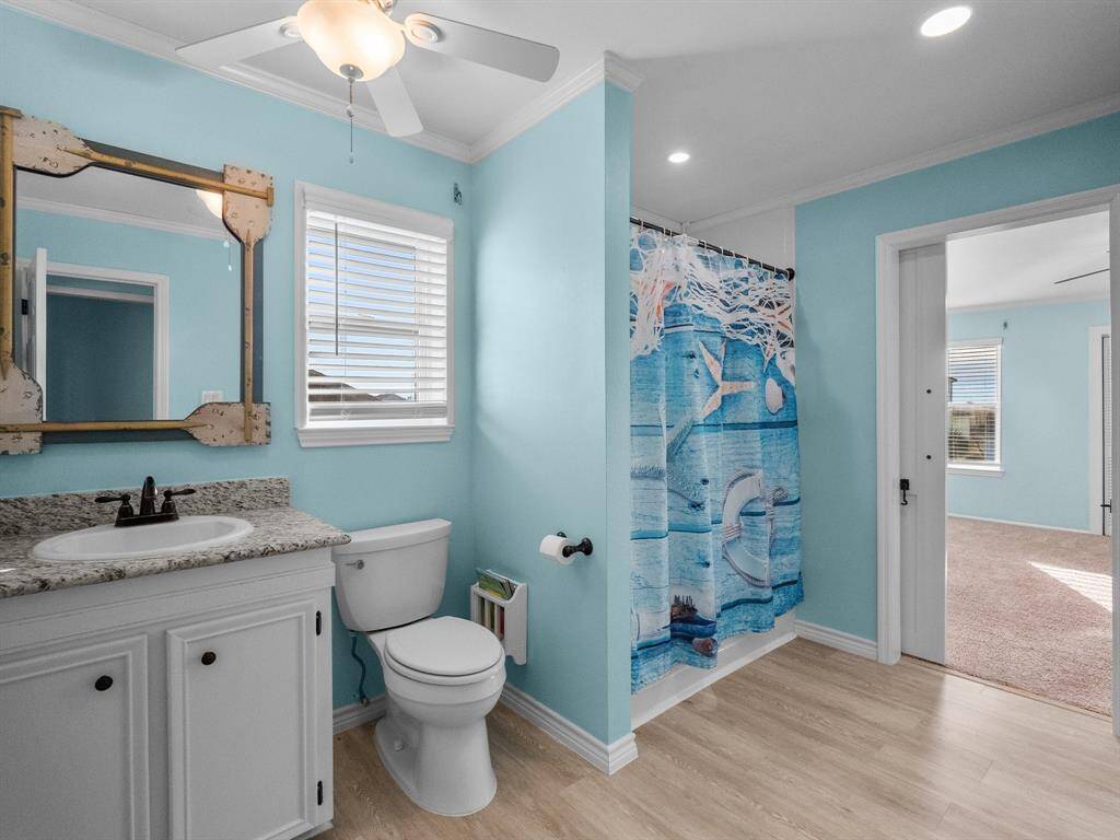 Secondary bathroom upstairs is en suite to the upstairs primary bedroom.