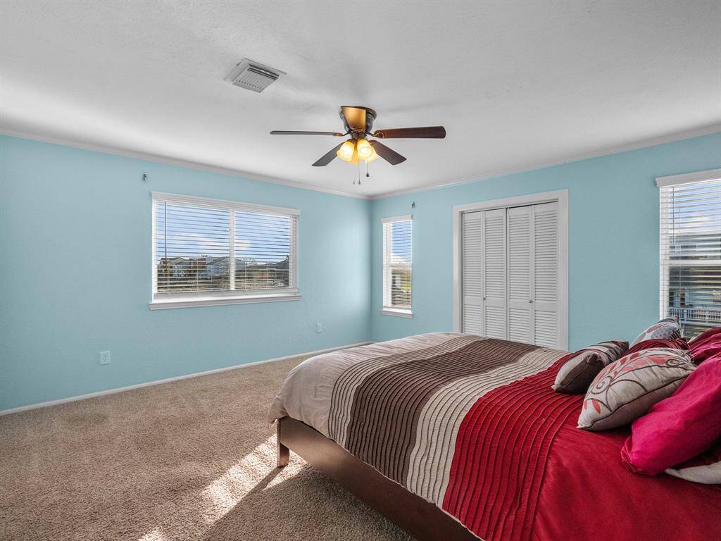 Lay in bed and take in the views! This upstairs second primary bedroom has 2 closets.
