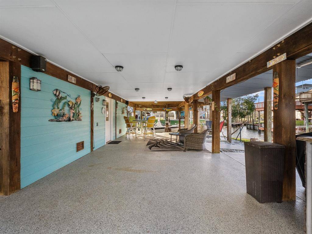 This space is gated for your pets and a great space for entertaining. Lights in the ceiling make this space the perfect outdoor dining or living area.