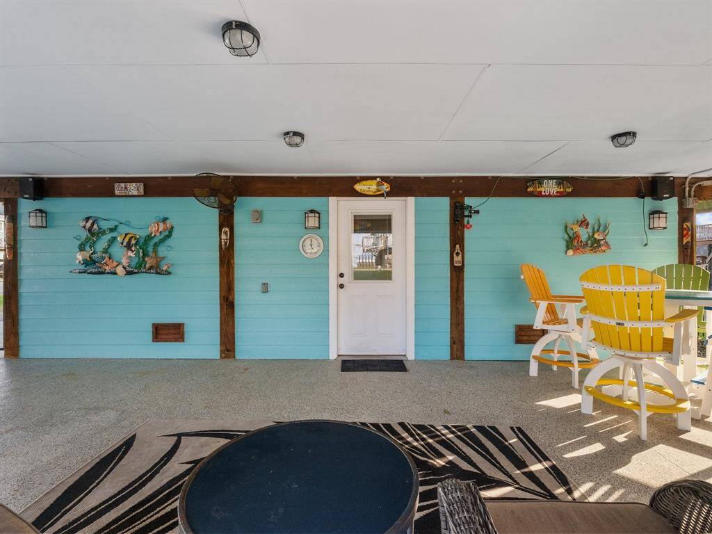 The closed in area under the home is the golf cart garage and the She "Man Cave."