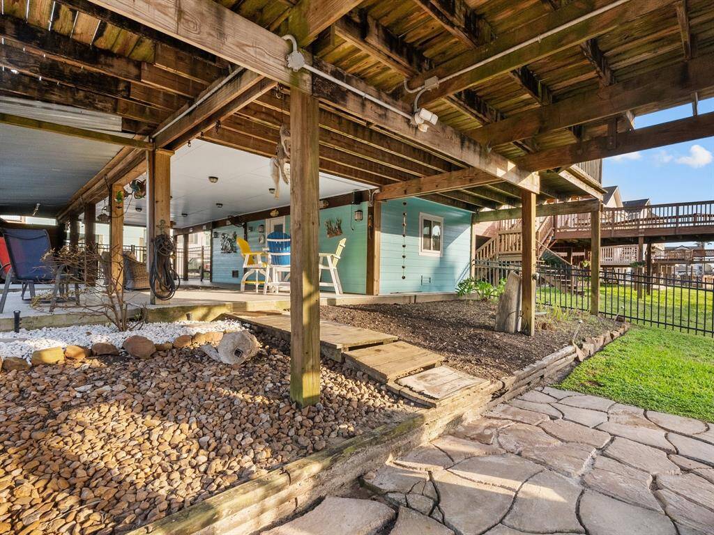 Another look under the house. The powder coated steel fence around the home keeps your pets in but does not block your view. Such a great place to relax!