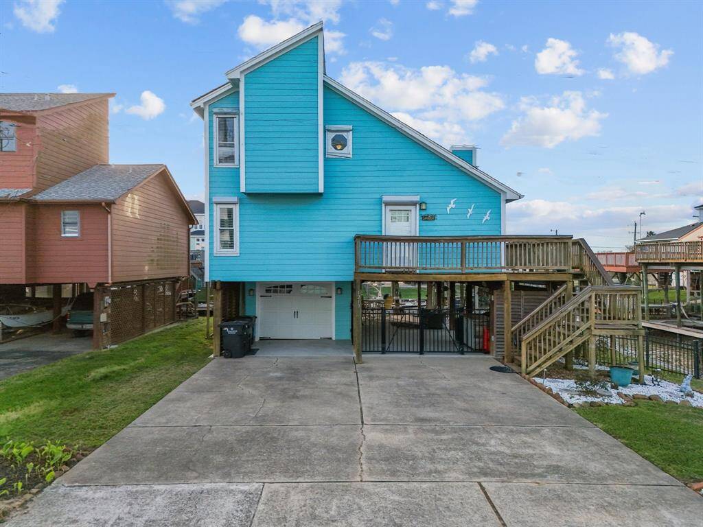 Double wide driveway, golf cart garage, downlighting up the stairs and down the balcony, roll down hurricane shutters and powder coated steel fencing around the property.