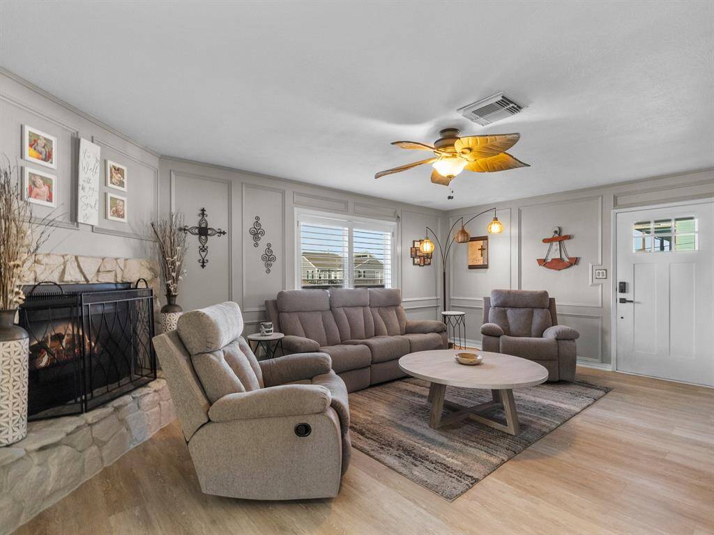 Plantation shutters add more functional beauty to this room and the fireplace is the heart!
