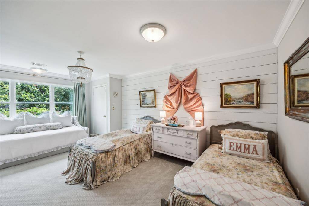 Largest of 3 bedrooms with shiplap accent wall and treetop views.