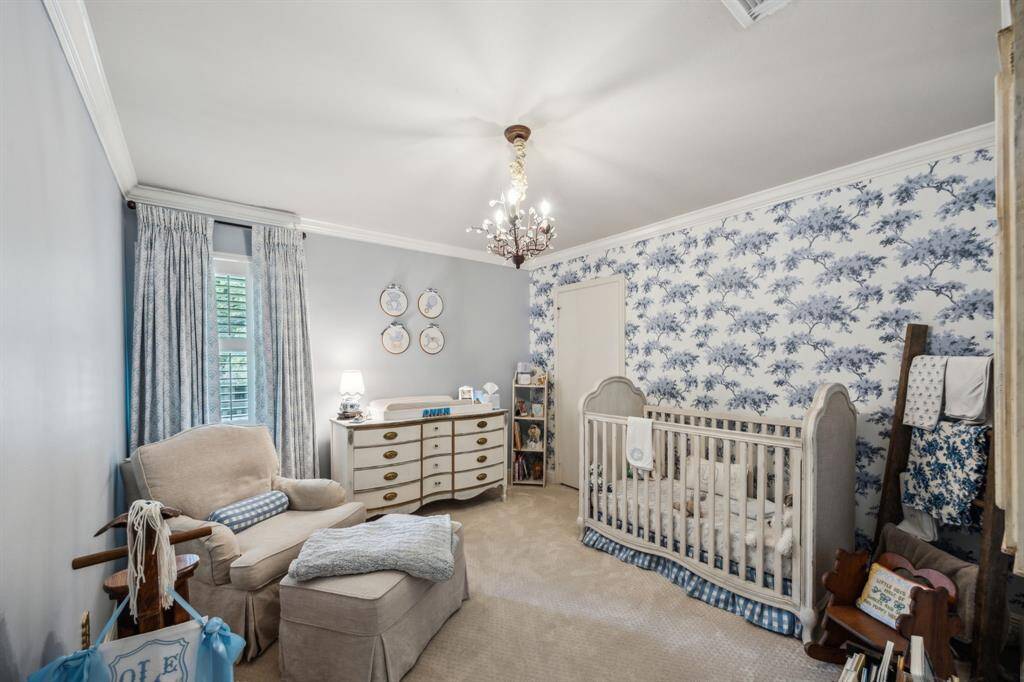 Precious guest bedroom with beautiful wallpaper.