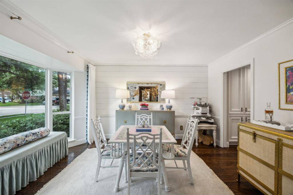 Current formal dining room with view towards the tree lined street. This space would work perfectly as an office.