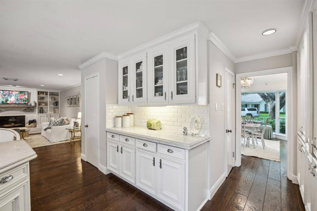 Note the seamless flow from the kitchen to the den.